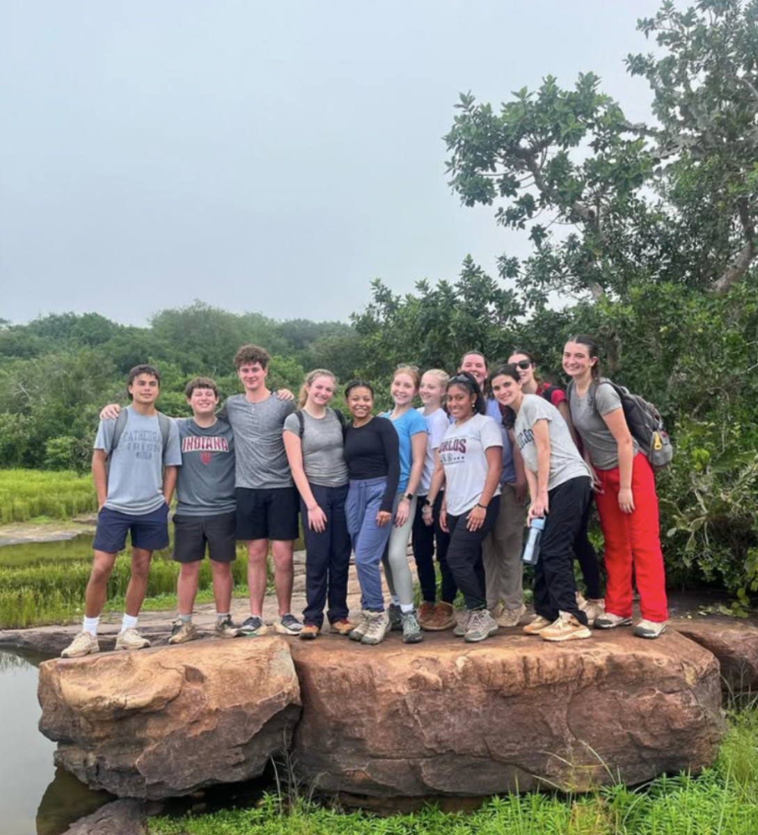 Seniors pose for a group shot after a long hike in Kenya. Cathedral took a group of Sophomores, Juniors, and Seniors on a mission trip to Kenya over J-Term. Senior Samantha Durm said, “The hike was amazing just to see the natural beauty that Africa had to offer.” 